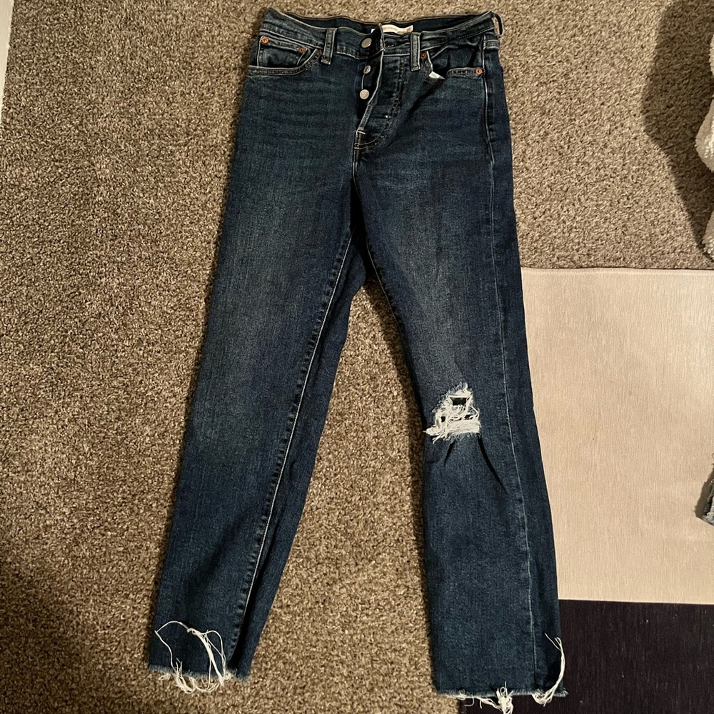Levi’s blue jeans with distressed hem